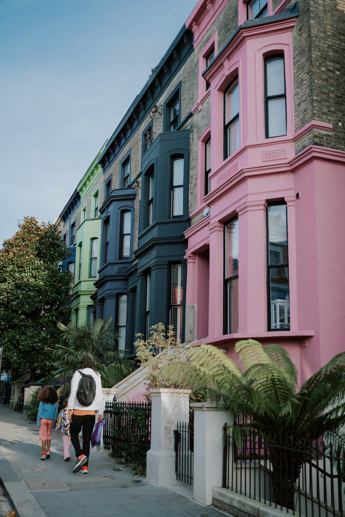 Row of terraced houses painted in confident colours, an example of exterior house painting